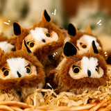 A round, fluffy brown Long-eared Owl bird plush keychain with a cream-colored face and golden eyes