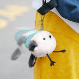 A small, round white Long-tailed Tit bird plush keychain with dark grey wings and tiny black eyes