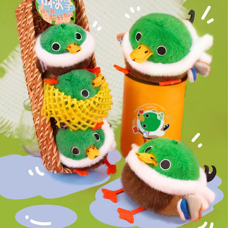 A round, fluffy Mallard duck bird plush keychain with a green head, white ring, and brown body, featuring orange legs and a yellow beak