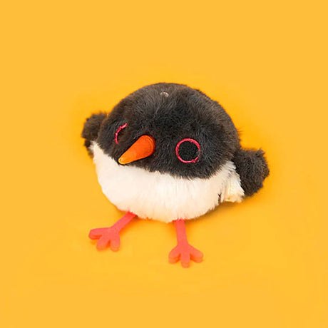 A round, black and white Oystercatcher bird plush keychain with a bright orange beak and pink feet, featuring red-rimmed eyes