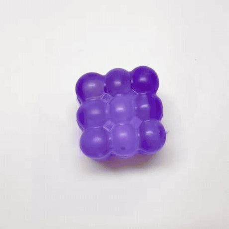 Purple color Bubble Wrap Squishy Fidget Toy featuring a 3x3 grid of squeezable jelly bubbles. This slow-rising bubble pop fidget provides instant stress relief and tactile sensory healing for office workers and students. A trendy desktop accessory and viral squishy toy ideal for fidgeting and anxiety relief
