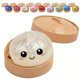 Six colorful, glittery Rainbow Mystery Squishy dumpling toys with cute cartoon faces sit inside mini plastic bun steamer baskets