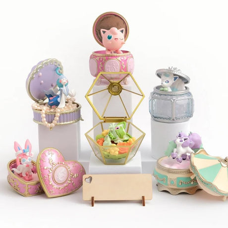 Officially licensed Pokémon Romantic Collection Re-Ment blind box figures displaying Sylveon, Primarina, and Galarian Ponyta inside decorative vintage jewelry boxes on a vanity setup