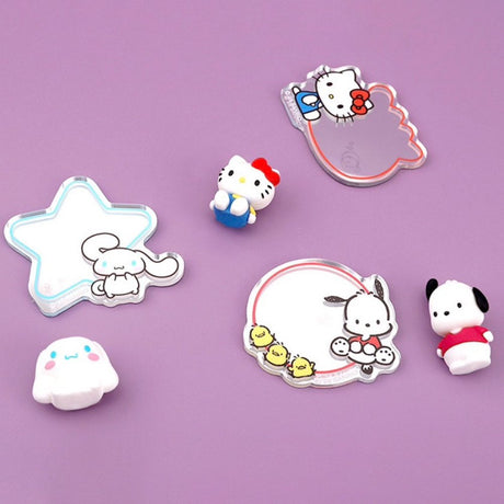 A collection of ten colorful, die-cut acrylic mirrors featuring officially licensed Sanrio characters like Hello Kitty, My Melody, and Cinnamoroll. Each mirror includes a character illustration next to a small reflective surface in various shapes like stars, clouds, and hearts.
