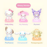A set of 12 officially licensed Sanrio character figures, featuring two distinct finishes: 6 regular matte models and 6 glossy models. Each character sits on a translucent cloud base that lights up upon gentle impact.