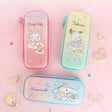 Three officially licensed Sanrio hard shell pencil cases featuring Hello Kitty, Pochacco, and Cinnamoroll on dreamy pastel glitter gradients