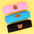 Three officially licensed Sanrio fabric pencil cases featuring stitched faux-leather character patches.