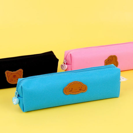 Three officially licensed Sanrio fabric pencil cases featuring stitched faux-leather character patches.