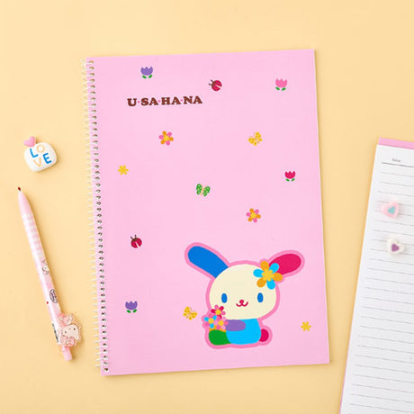 An officially licensed Sanrio three colorful spiral notebooks featuring Chococat, Hangyodon, and Usahana, comes with lined paper and a subtle character illustration in the bottom corner
