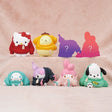 Officially licensed Sanrio Characters Okigaechu Figure Blind Box showing Sanrio characters bundled up in oversized knit sweaters