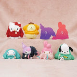 Officially licensed Sanrio Characters Okigaechu Figure Blind Box showing Sanrio characters bundled up in oversized knit sweaters