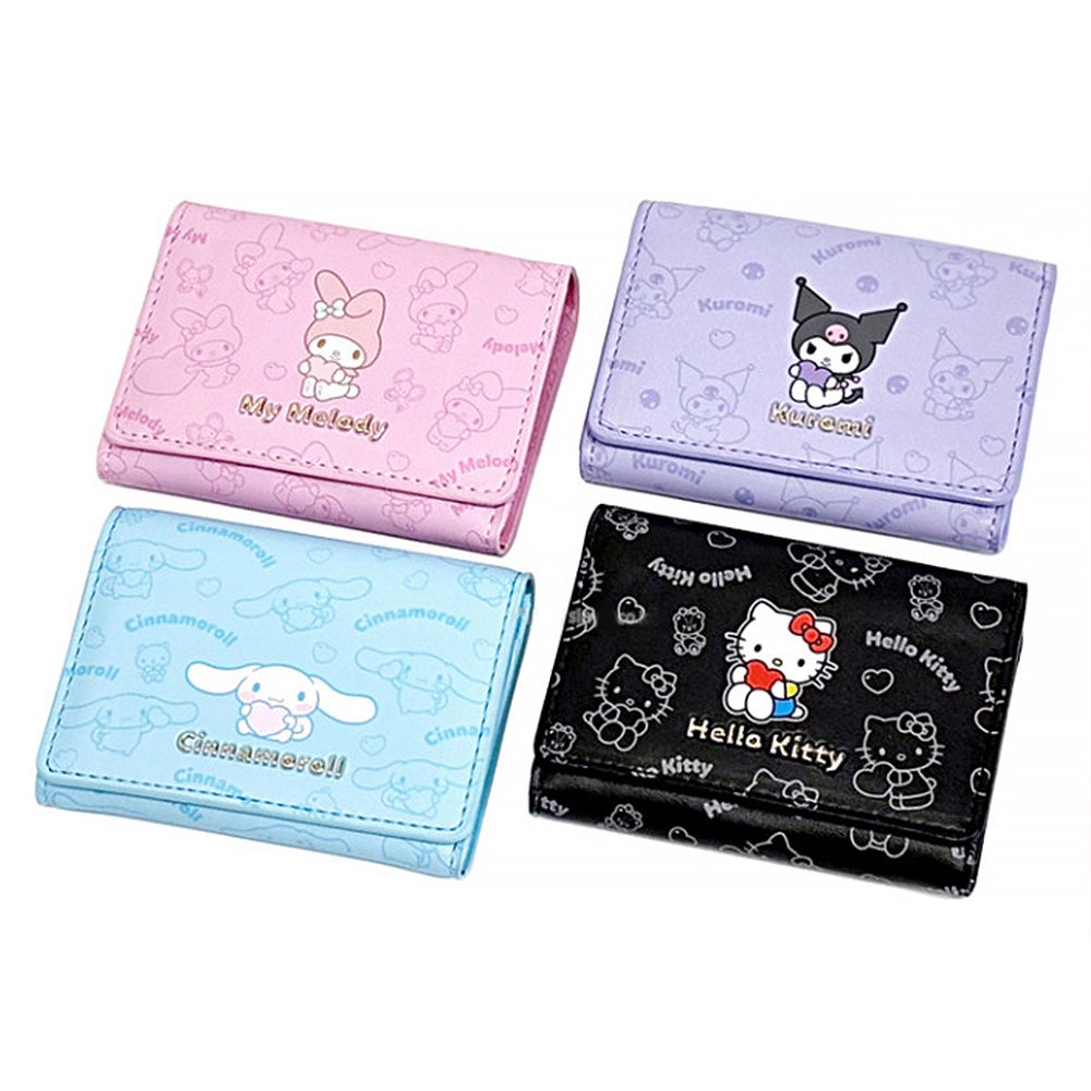An officially licensed collection of four Sanrio character mini wallets in black, pink, purple, and blue featuring Hello Kitty, My Melody, Cinnamoroll, and Kuromi with gold-lettered names.