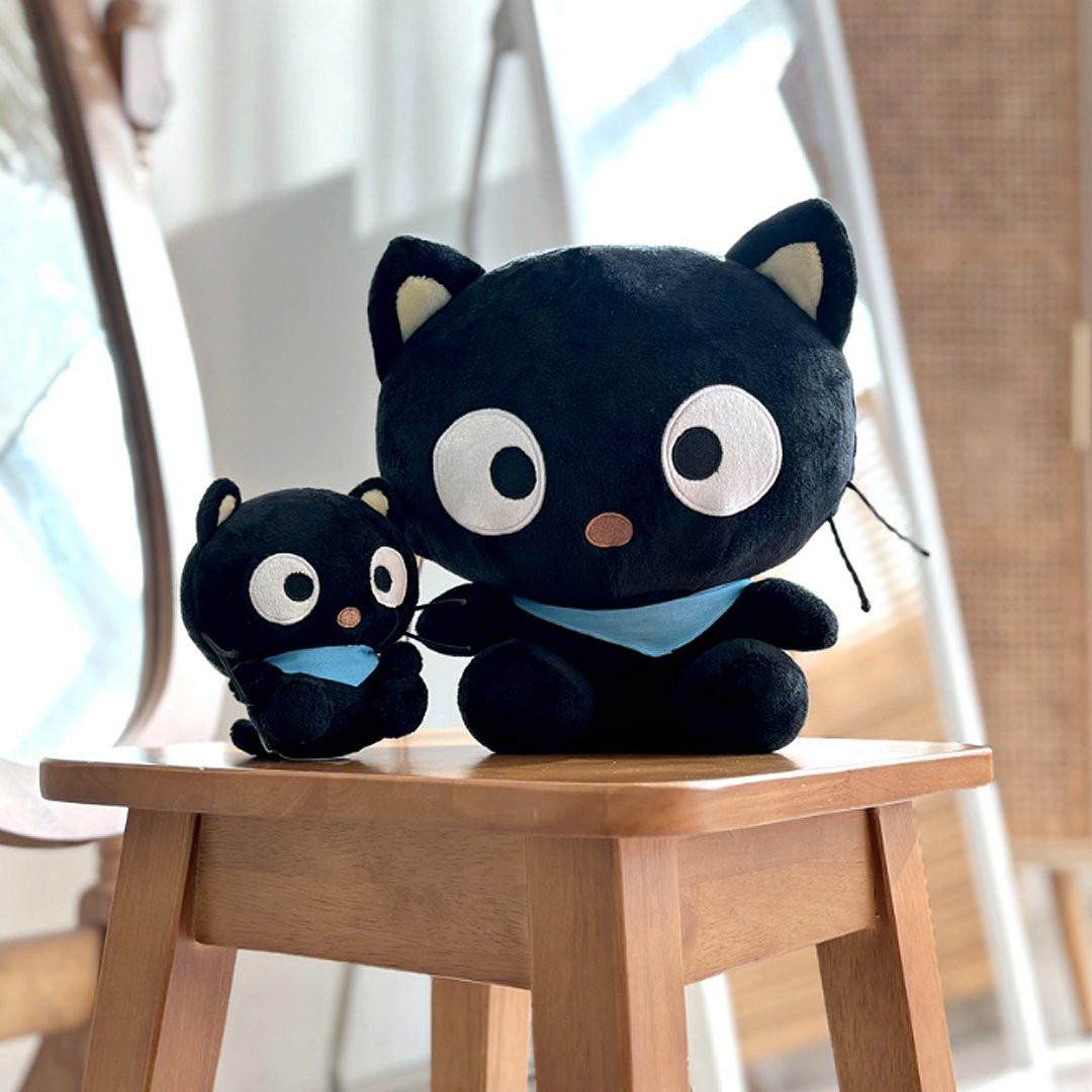 Officially licensed Sanrio Chococat plush with signature blue scarf. This authentic black cat stuffed animal features iconic big eyes and whiskers, making it a must-have for Chococat collectors and Sanrio fans.