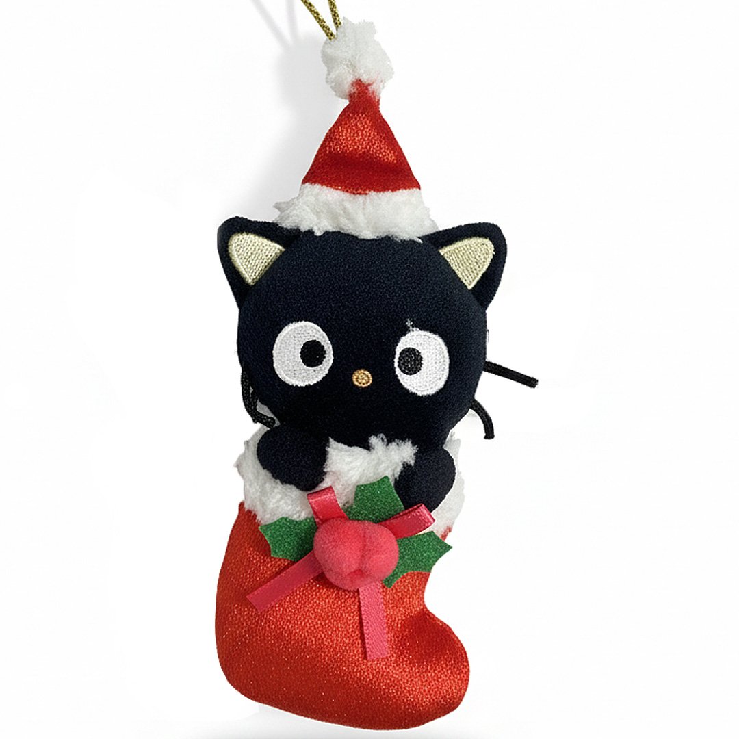 Chococat is dressed for the season wearing a red Santa hat with a white pom-pom while sporting his signature red bow. He sits snugly in a red Christmas stocking adorned with green holly leaves and a decorative ribbon. Crafted from soft plush material, this ornament has a cozy, huggable feel. The attached gold cord loop makes it easy to hang on your Christmas tree.