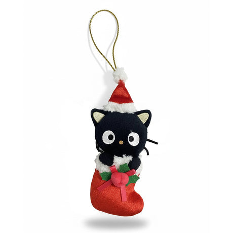Sanrio Chococat is dressed for the season wearing a red Santa hat with a white pom-pom while sporting his signature red bow. He sits snugly in a red Christmas stocking adorned with green holly leaves and a decorative ribbon. Crafted from soft plush material, this ornament has a cozy, huggable feel. The attached gold cord loop makes it easy to hang on your Christmas tree.
