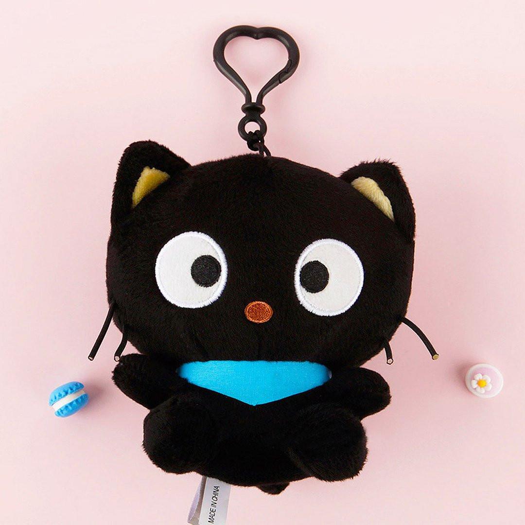 Officially licensed Sanrio Chococat mascot plush with signature blue scarf. This black cat stuffed animal features iconic big eyes and whiskers. Perfect for ornament , displaying, bag charm or gifting to Sanrio fans of all ages.