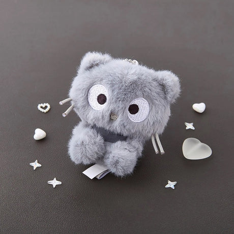 An officially licensed Sanrio character, this monochrome Chococat can be a stylish decor that brightens up a neutral-toned office desk or joining a high-end Sanrio display, he brings a cozy vibe to any setting. His signature large eyes are beautifully rendered with bold white and black embroidery, and his iconic stiff whiskers are reimagined as soft, flexible grey accents.