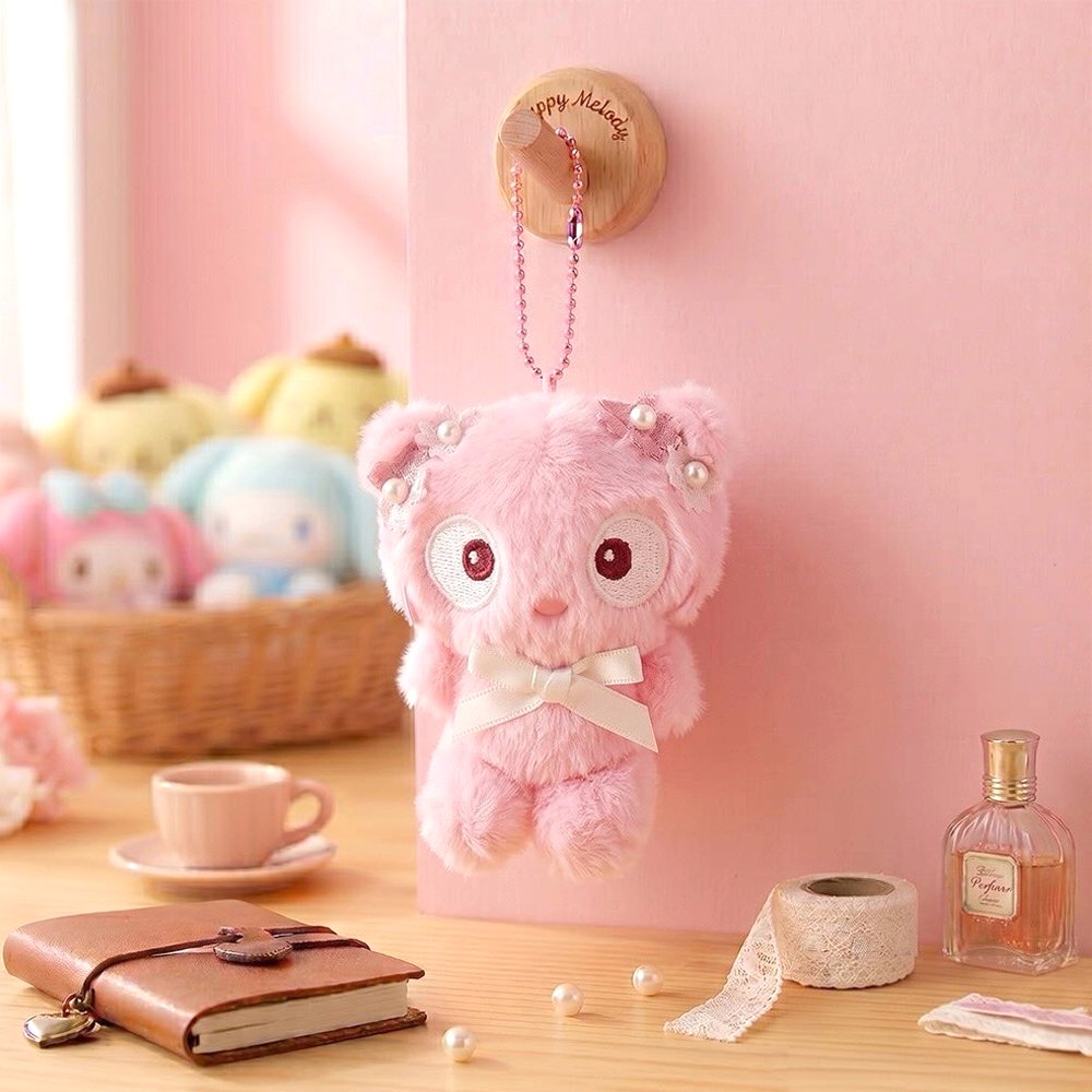Officially licensed Sanrio Chococat pink tone plush keychain styled in dreamy pastel pink and soft white hues with color-matched embroidered features, dangling from a ball chain