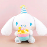 Officially licensed Sanrio Cinnamoroll plush, wearing a charming white party hat topped with a bright yellow tassel, and holding a cake for celebrating a special day.