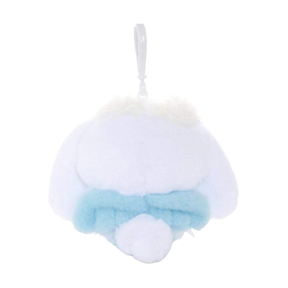 An officially licensed Sanrio Cinnamoroll plush keychain featuring the character in a blue ballerina tutu and polka-dot bodice with a yellow star detail. The plush includes fluffy white head trim, angel wings, and a white plastic clip for easy attachment.
