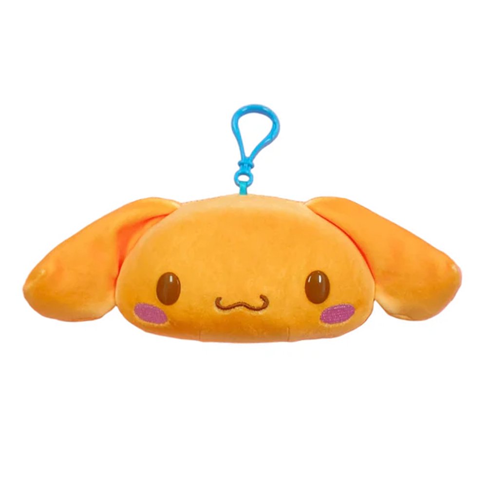 An officially licensed Sanrio plush keychain of Cinnamoroll in a golden-brown bread-like color. The plush features his long ears, purple blushing cheeks, and a blue plastic attachment clip.