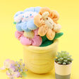 An officially licensed Sanrio plush bouquets featuring Cinnamoroll as soft, colorful flowers inside plush pots. The yellow planter is beautifully embroidered with character name.