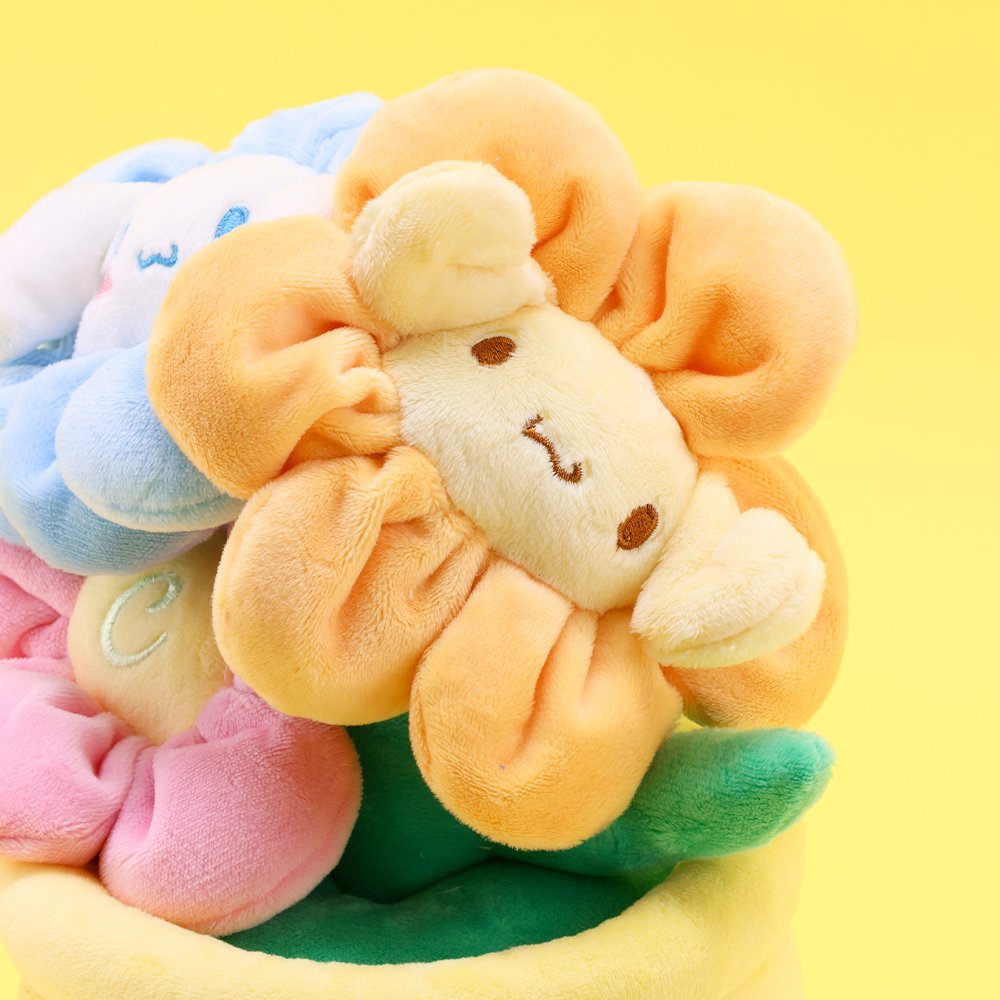 An officially licensed Sanrio plush bouquets featuring Cinnamoroll as soft, colorful flowers inside plush pots. The yellow planter is beautifully embroidered with character name.