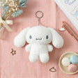 An officially licensed Sanrio fluffy monochromatic tone of grey and white Cinnamoroll plush keychain with a silver metal keychain
