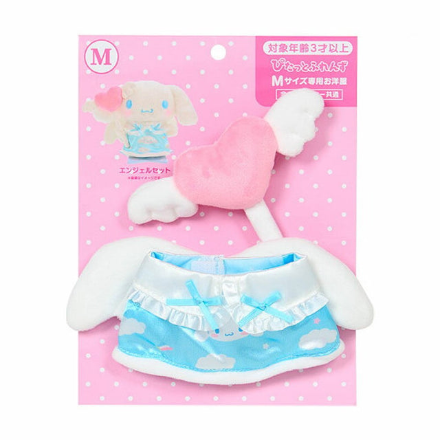A Sanrio Pitatto Friends M-size doll outfit called the "Angel Set" on a pink polka-dot backing card. The set includes a light blue satin dress with cloud and rainbow prints, white ruffles, and blue bows. Above the dress is a pink plush heart with white wings on a stick. Large white plush wings are shown behind the dress.