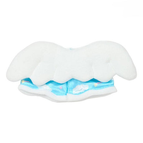 A Sanrio Pitatto Friends M-size doll outfit called the "Angel Set". The set includes a light blue satin dress with cloud and rainbow prints, white ruffles, and blue bows. Above the dress is a pink plush heart with white wings on a stick. Large white plush wings are shown behind the dress.