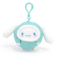 Officially licensed by Sanrio Cinnamoroll plush keychain in winter mint color puffer jacket . on a white background.  There're perfect for bagpack charm, keychain, displaying, or gifting to Sanrio fans of all ages.