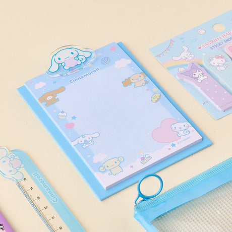 Officially licensed Sanrio Cinnamoroll stationery set featuring a clear zipper pouch, character-topped pens, sticky index memos, memo pad, random strap keychain, and a themed ruler.