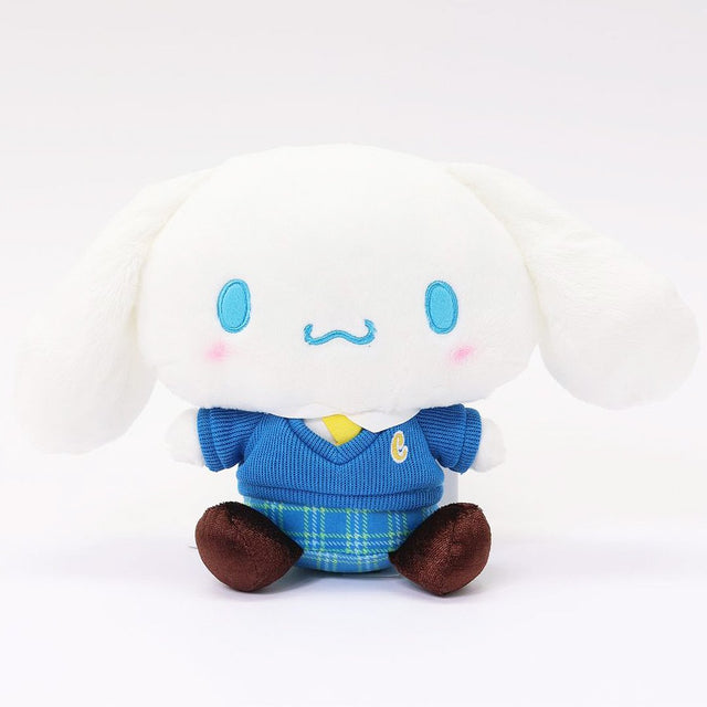 Sanrio officially licensed Cinnamoroll plush doll dressed in a school uniform. He wears a blue plaid skirt, a V-neck blue sweater, a yellow tie