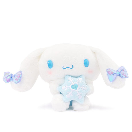 Sanrio Cinnamoroll Snow Angel 7-inch plush with iridescent bow, holding a blue snowflake, perfect for kawaii winter decor.