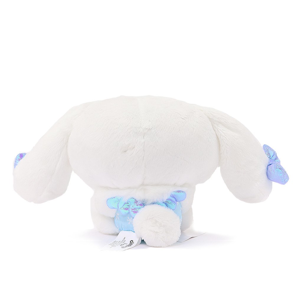 Sanrio Cinnamoroll Snow Angel plush in a blue snowflake print dress with an iridescent bow, and wings