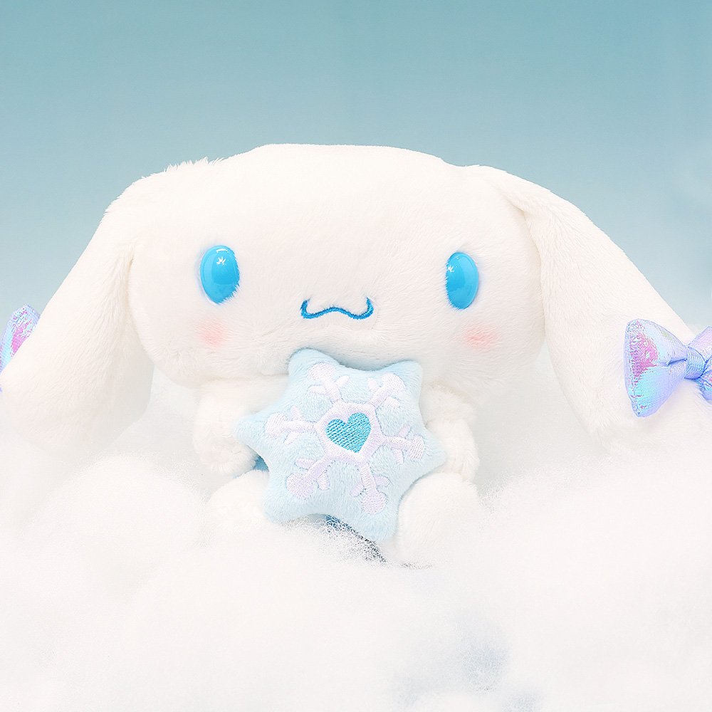 Magical Cinnamoroll Snow Angel plush sitting on soft clouds against a light blue background, creating a serene winter scene