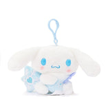 Sanrio Cinnamoroll Snow Angel mascot backpack keychain plush with iridescent bow, holding a blue snow flake. makes a great gift for Sanrio fans, plush collectors, Thanksgiving, or Christmas!