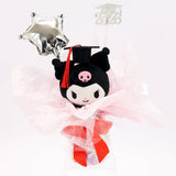 An officially licensed Class of 2026 Sanrio graduation gift set featuring six popular plush characters, Hello Kitty, My Melody, Cinnamoroll, Kuromi, Pompompurin, and Pochacco wearing black graduation caps. The characters are arranged like a bouquet with silver star balloons and "Congrats Grad" decorations.