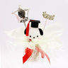 An officially licensed Class of 2026 Sanrio graduation gift set featuring six popular plush characters, Hello Kitty, My Melody, Cinnamoroll, Kuromi, Pompompurin, and Pochacco wearing black graduation caps. The characters are arranged like a bouquet with silver star balloons and "Congrats Grad" decorations.