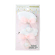 Packaged Cogimyun hair clip set with a bow and bear charm on a white background