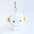 Sanrio Cogimyun Plush keychain with a cute face design on a white background. Ideal as collectible bag charms and accessories.