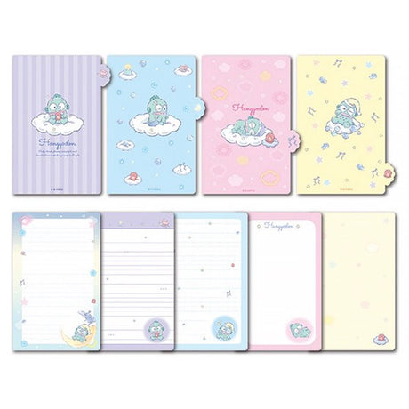 An officially licensed Sanrio Hangyodon spiral-bound notebook, featuring a glitter finish with gold stars and an illustration of Hangyodon. Includes four distinct, colorful dividers and five different interior page designs.