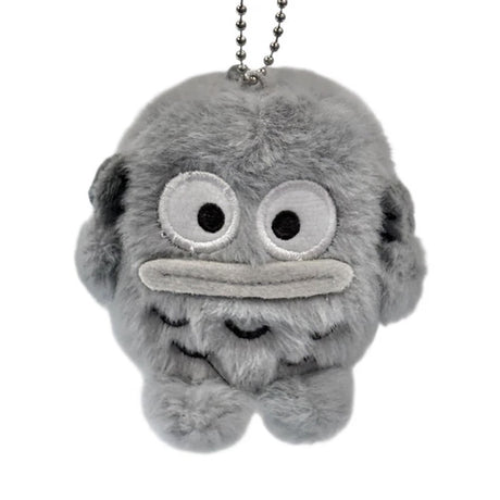 An officially licensed Sanrio character, this fluffy Hangyodon plush keychain features his signature large, wide-set eyes—rendered in crisp monochromatic schemed embroidery—and his iconic flat, grey-toned lips.