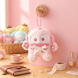 Officially licensed Sanrio Hangyodon pink tone plush keychain styled in dreamy pastel pink and soft white hues with color-matched embroidered features, dangling from a ball chain