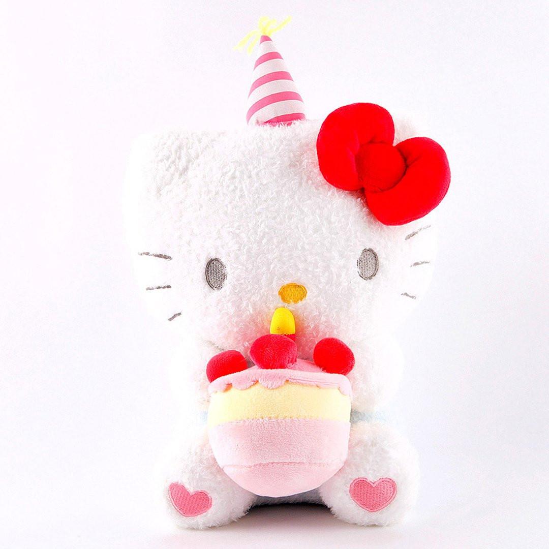 Officially licensed Sanrio Hello Kitty plush wearing a charming white party hat topped with a bright yellow tassel, and holding a cake for celebrating a special day.