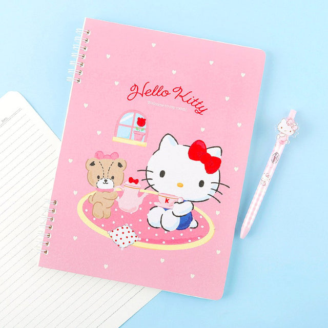 A soft pink, officially licensed Hello Kitty spiral lined notebook featuring Hello Kitty having a tea party with her teddy bear.