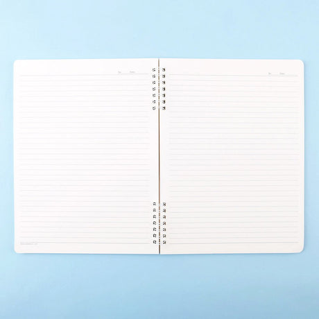 A soft pink, officially licensed Hello Kitty spiral lined notebook featuring Hello Kitty having a tea party with her teddy bear.