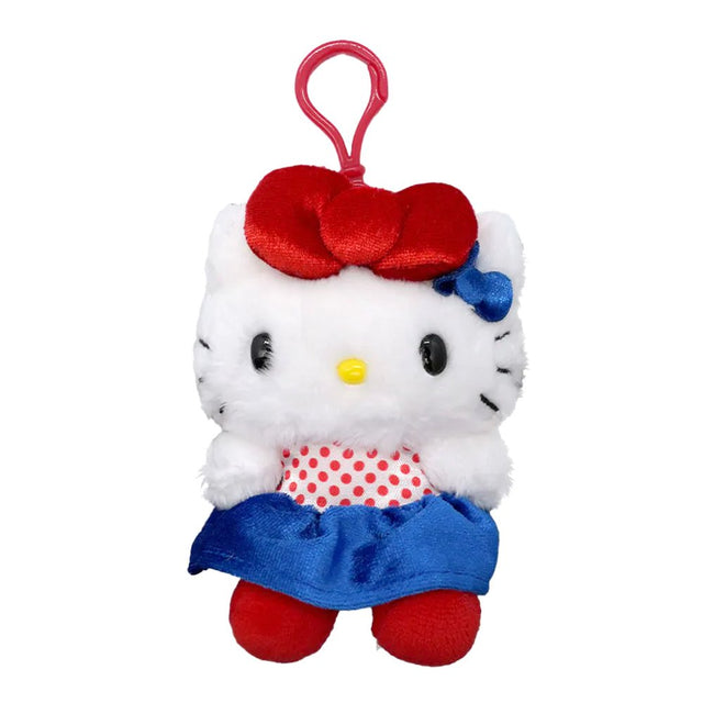 An officially licensed Hello Kitty Big Ribbon plush keychain wearing a red and white polka dot top with a blue satin skirt and red shoes.