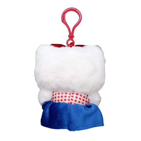 An officially licensed Hello Kitty Big Ribbon plush keychain wearing a red and white polka dot top with a blue satin skirt and red shoes.