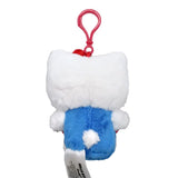 Officially licensed Hello Kitty plush keychain sitting and holding a large red plush bow, featuring her classic white fur, yellow nose, and signature red ear bow.
